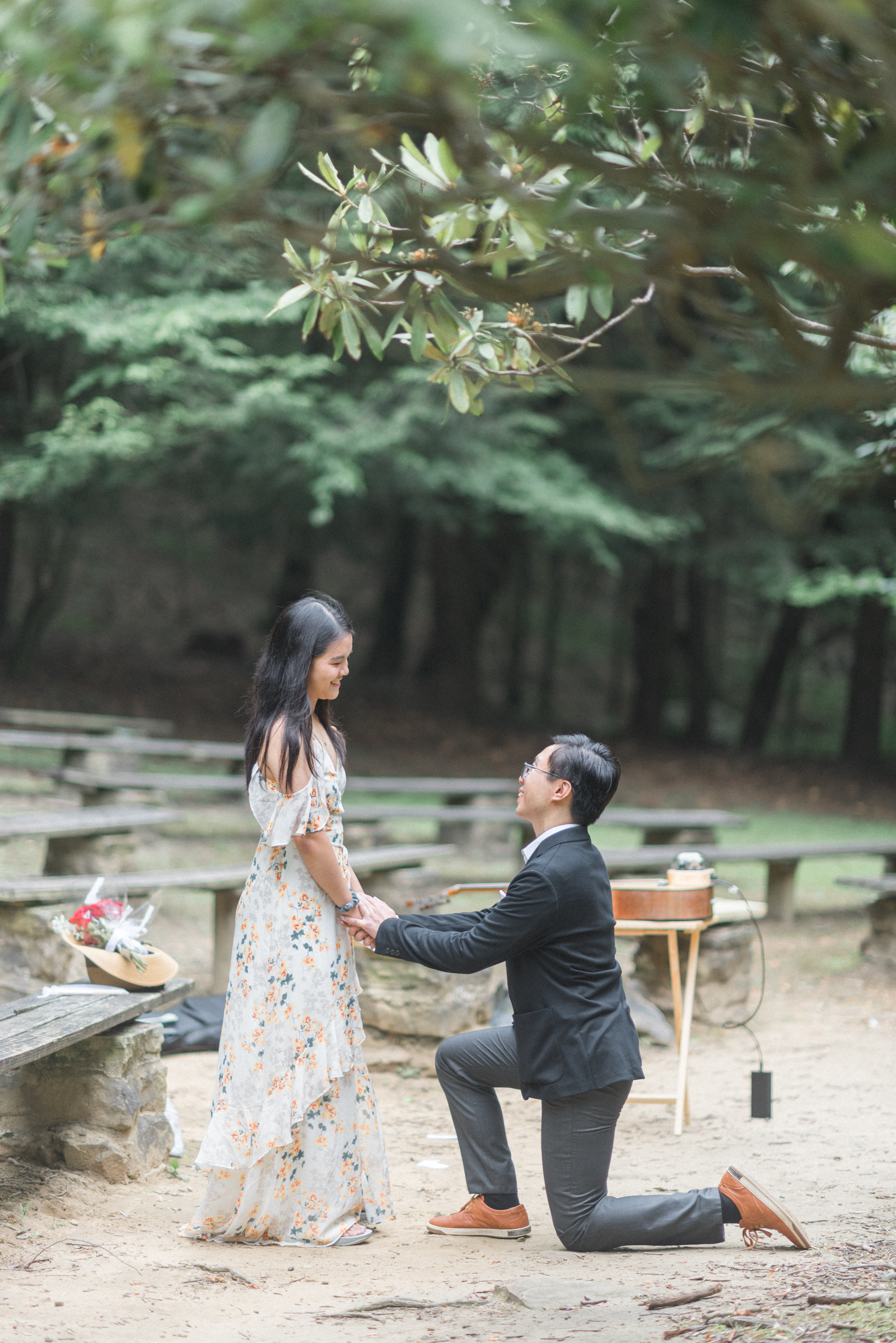 Daniel proposes to Tze Hui after singing In A Crowd of Thousands. Jumonville Green Cathedral, July 2023.